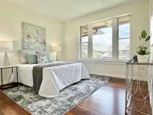 Bedroom in residence 648 with corner windows and bedside tables