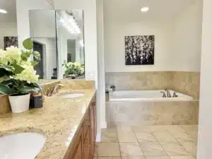 Primary bathroom in residence 648 with a soaking tub and double vanity