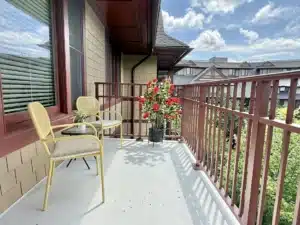 Balcony in residence 648 with patio seating and potted flowers