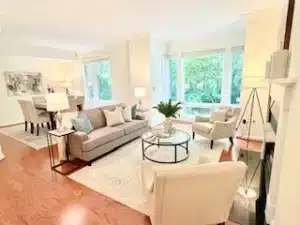 living room with a couch and large windows
